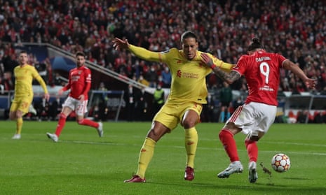 Darwin Nunez of Benfica appears to be held by Virgil van Dijk of Liverpool in penalty box.