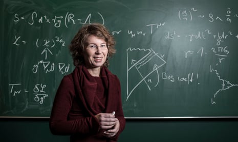 dr sabine hossenfelder in front of a blackboard with physics equations at the frankfurt institute for advanced studies