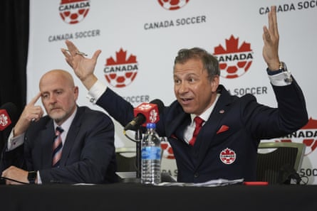 Nick Bontis, right, during a news conference in Vancouver last June.