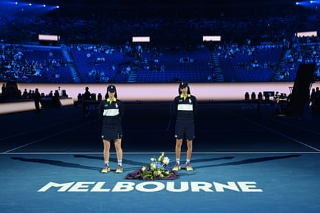 A bouquet is placed on the court at Rod Laver Arena during the minute of silence for the victims of the Bondi attack.