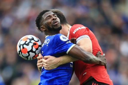 Kelechi Iheanacho of Leicester City runs into Harry Maguire of Manchester United as Leicester win 4-2.