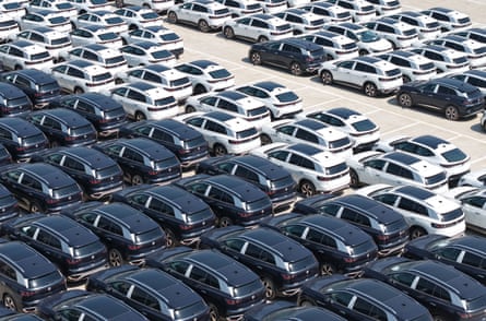 Rows of dozens of electric cars