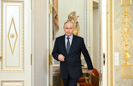 he is walking through a doorway with gold decoration.