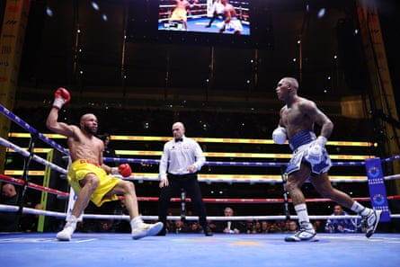 Chris Eubank Jr is knocked down by Conor Benn during their middleweight fight.