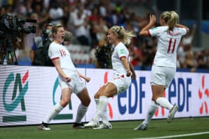Ellen White of England celebrates with teammates after scoring the team's first goal.
