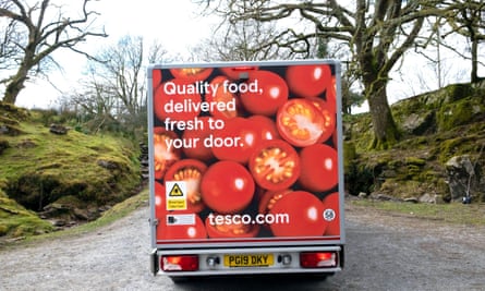 Tesco supermarket van rear delivering food to a customer home in rural Wales during the Covid-19 pandemic