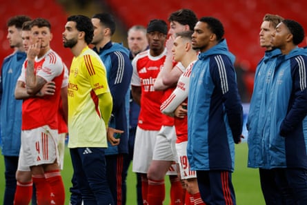Arsenal players on the pitch after losing to Manchester City