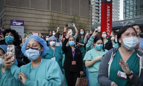 Medical personnel attend a daily 7pm applause in their honor outside NYU Langone Medical Center. Since then nurses in New York have suffered understaffing and burnout.