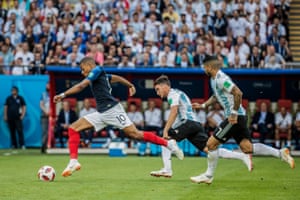 France’s Kylian Mbappé glides away from Argentina’s Nicolás Tagliafico and Éver Banega during the round of 16 match in Kazan.