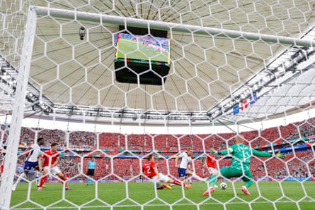 England’s Harry Kane scores the opening goal of the game during the UEFA Euro 2024 group stage match between Denmark and England.