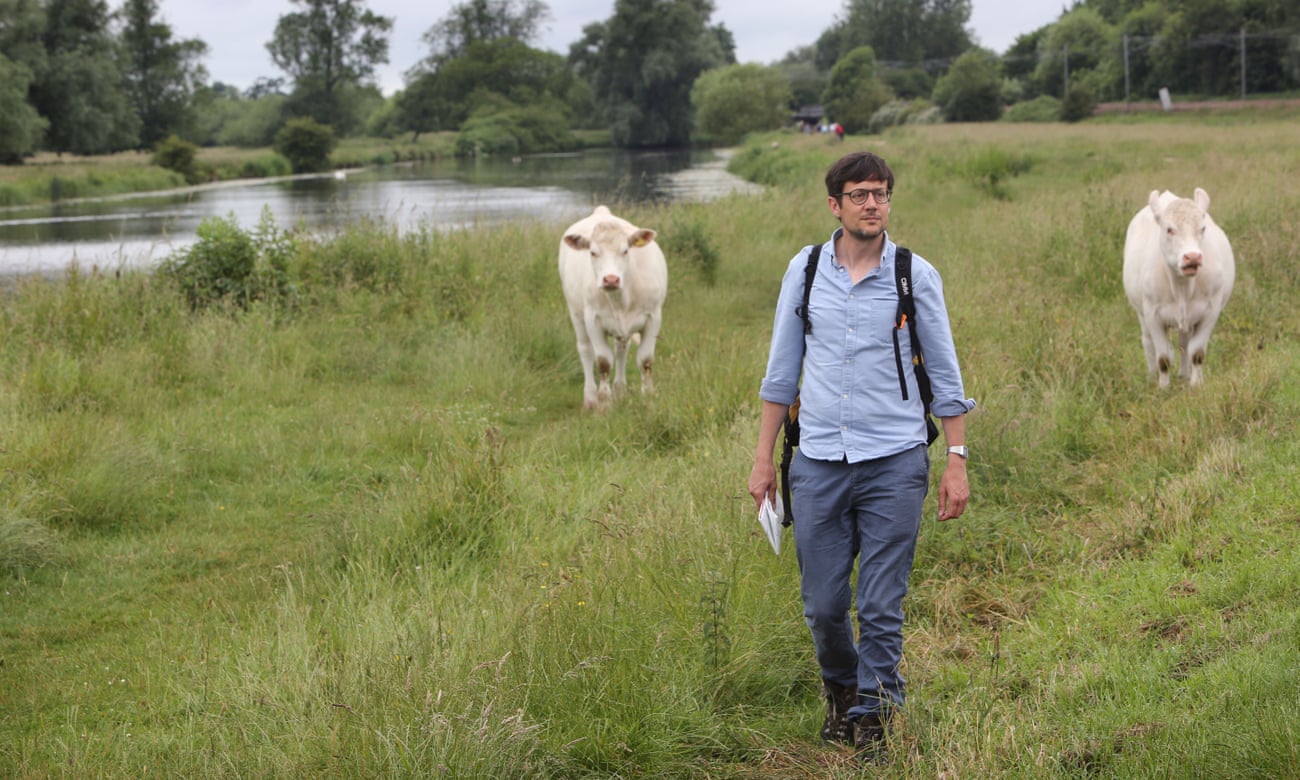 Patrick Barkham walking next to the river Great Ouse at Ely.