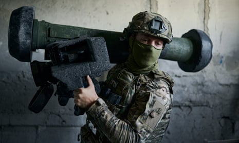 A Ukrainian soldier holds an anti-tank missile in his position in Avdiivka, Donetsk region.