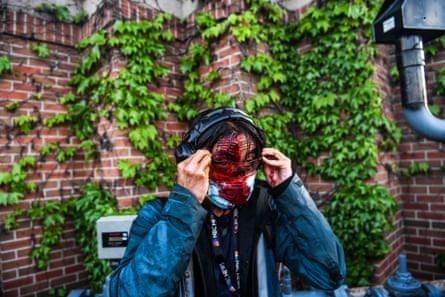 NBC News journalist Ed Ou bleeds after police started firing tear gas and rubber bullets near the 5th police precinct following a demonstration to call for justice for George Floyd, a black man who died while in custody of the Minneapolis police, on May 30, 2020 in Minneapolis, Minnesota.