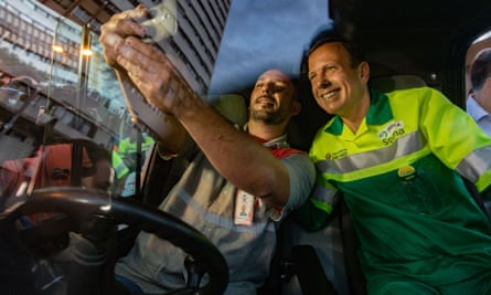 Doria poses for a selfie after clearing part of a city square in downtown São Paulo.