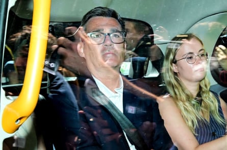 Andy Burnham in a London black cab with a woman beside him.