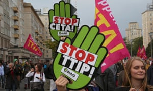 Consumer rights activists take part in a march to protest against TTIP and CETA in Berlin.