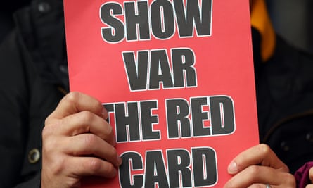 Nottingham Forest fans hold up messages protesting against the use of VAR in December 2023