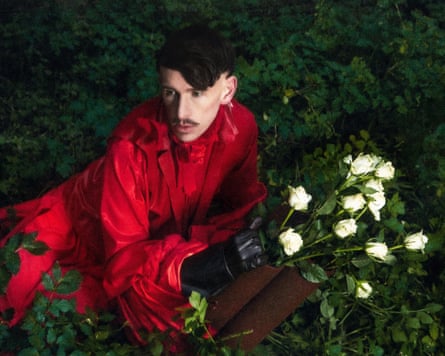 Patrick Wolf holding a bouquet