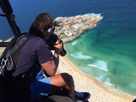 Photographer Eugene Tan shoots from a helicopter