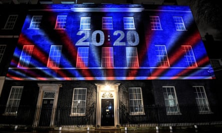 10 Downing Street with red white and blue lights and a countdown clock projected on to it