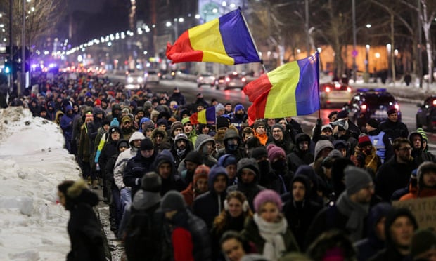 Protesters in Bucharest demonstrate against government plans to grant prison pardons through emergency decree.
