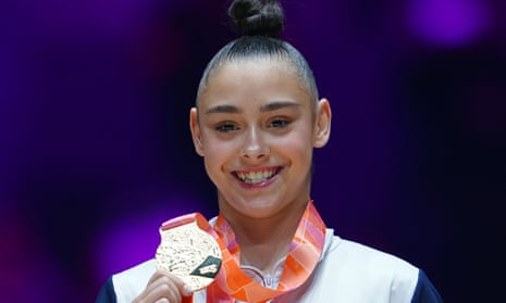 Jessica Gadirova shows off her gold medal at the world gymnastics championship in Liverpool