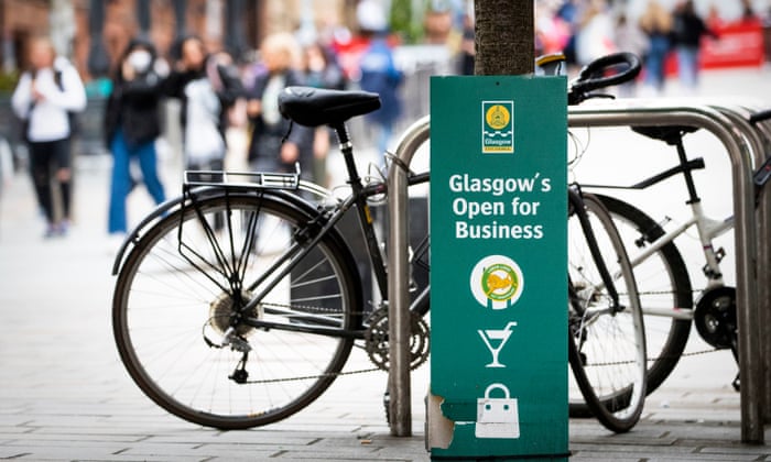 A sign reads ‘Glasgow’s Open for Business’ in Glasgow city centre on 28 May.