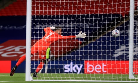 Brentford goalkeeper David Raya is caught unawares by the free-kick from Fulham’s Joe Bryan.