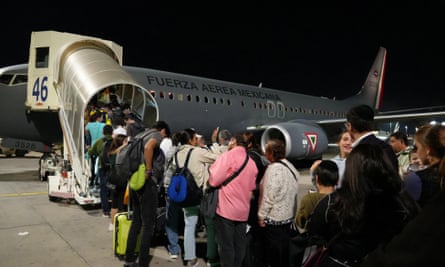 Mexicans board a plane of the Mexican Secretariat of National Defense (SEDENA) during a repatriation flight to Mexico, at Ben Gurion International Airport in Tel Aviv