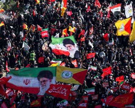 Mourners gather on the day of the burial in Mashhad.