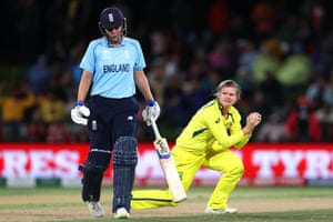 Jess Jonassen of Australia bowls and catches out Kate Cross of England.