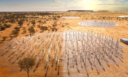 Image of a desert with clusters of small radiotelescope antennae in groups a short distance apart
