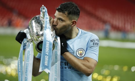 Manchester City’s Sergio Agüero kisses the Carabao Cup after his side’s 3-0 win over Arsenal.