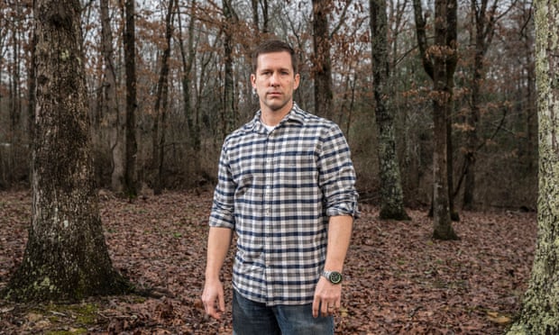 Photograph of Andy Peterson in a wood