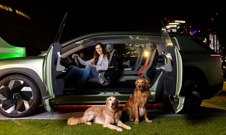 Ursula Aitchison with her dogs Hugo and Huxley promote Škoda's Vision 7S electric car. 