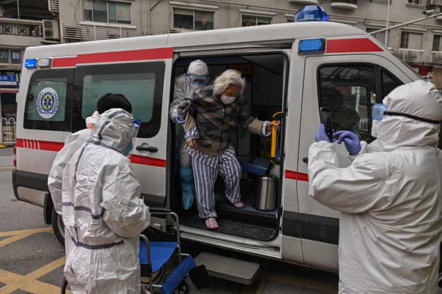 An elderly woman arrives in an ambulance to Wuhan Red Cross Hospital