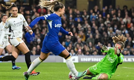 Real Madrid’s goalkeeper Mylene Chavas saves at the feet of Chelsea’s Johanna Rytting Kaneryd.
