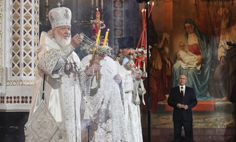 The Russian Orthodox church’s Patriarch Kirill conducts an Easter service as Vladimir Putin looks on in April