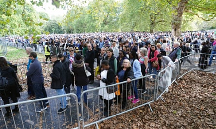 People wait in line to view the Queen’s coffin.