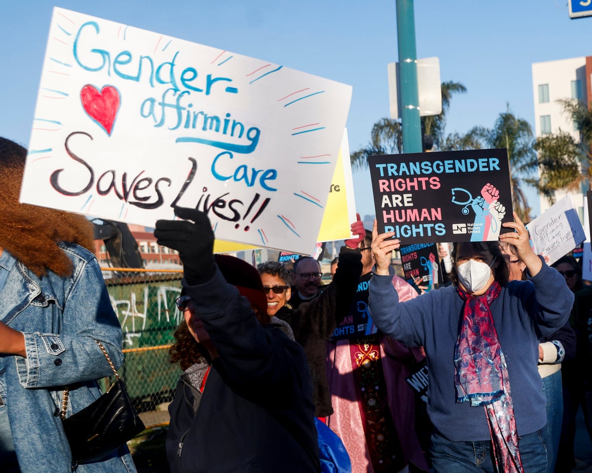 US federal employees file complaint against ban on gender-affirming care | Trump administration | The Guardian