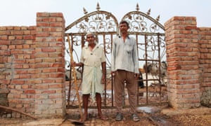 Two workers at a gaushala, where strays cows are given homes and attended to for life.