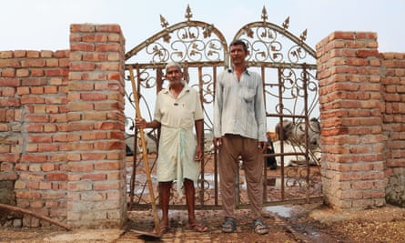 Two workers at a gaushala, where strays cows are given homes and attended to for life.
