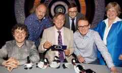 QI in 2009 with Alan Davies, left, host Stephen Fry, centre, and host-to-be Sandi Toksvig, right.