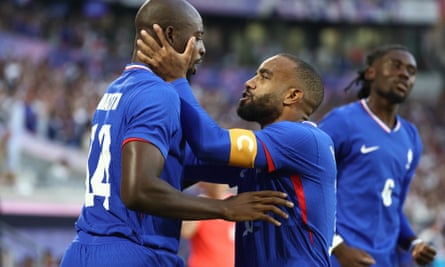 Jean-Philippe Mateta (left) celebrates with Alexandre Lacazette after scoring France’s first goal in the quarter-final win over Argentina.