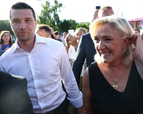 Marine Le Pen and Jordan Bardella arrive before attending a country fair with supporters in Lievin, northern France.