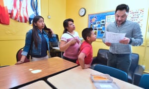 Marcelo Olmos, development director at Academia Avance charter school in Los Angeles, examines forms filled out during a parent engagement session.