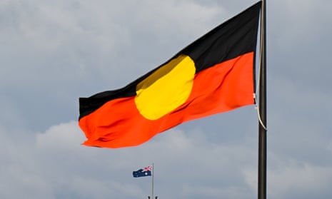 An Aboriginal flag flying on a flagpole 