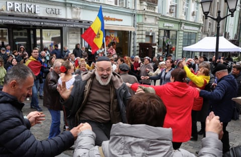 Groups of people dancing together holding hands
