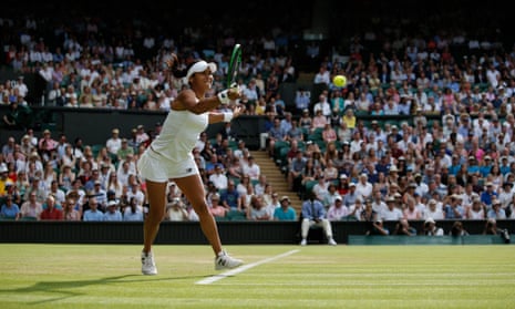 Heather Watson returns to Serena Williams but is struggling against her powerful serve.