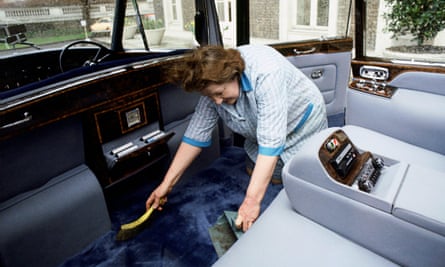 A cleaner works on the Rolls-Royce Phantom VI given to the queen as a silver jubilee gift.